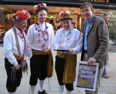 Martin Tod collects Trip to the Shops signatures from Christmas Clog Morris Dancers in Winchester High Street