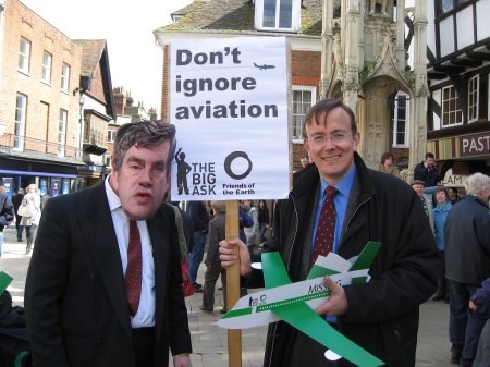 Martin Tod and Dave Walker-Nix from Winchester Friends of the Earth campaigning for aviation to be included in the Climate Change Bill by the Butter Cross in Winchester